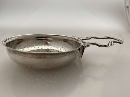 A George III silver lemon strainer, London 1763.