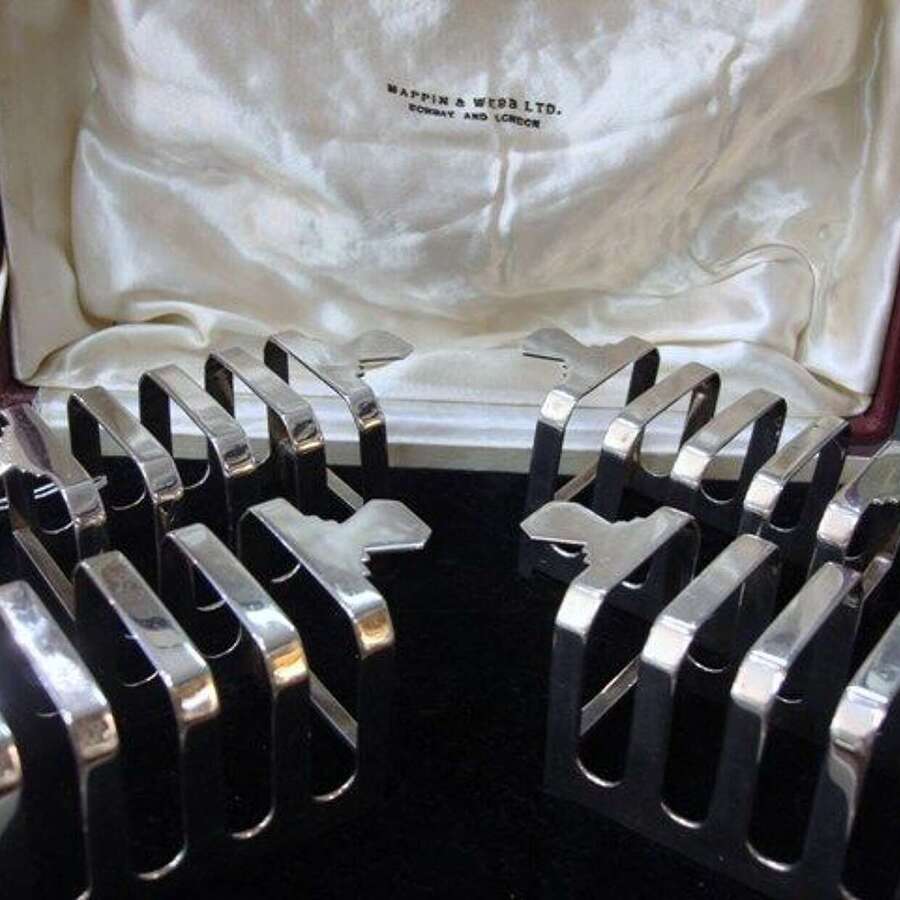 A Set of Four Toast Racks.