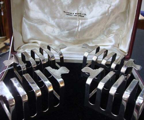 A Set of Four Toast Racks.
