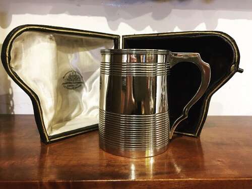 A Cased Georgian Silver Christening Mug.