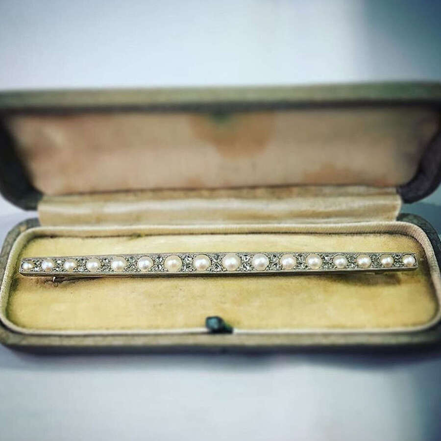 An 18ct Gold and Platinum, Pearl and Diamond Brooch.