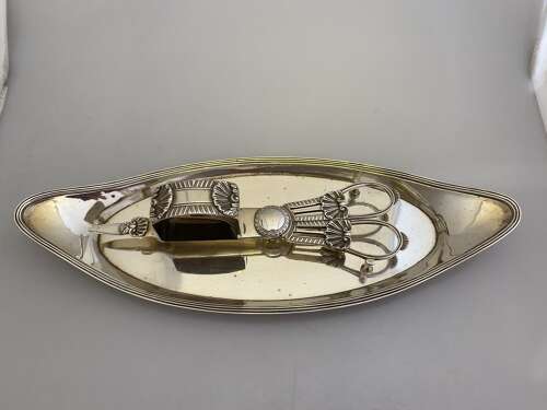 A Georgian silver candle wick trimmer and snuffer tray by Timothy Renou, London 1801/1813.