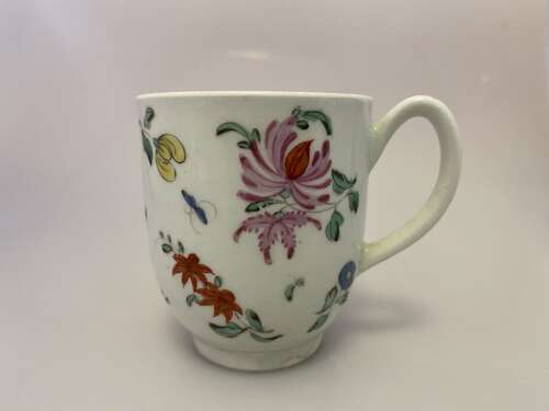 An early Worcester coffee cup decorated with sprays of flowers and butterflies, circa 1768