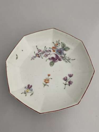 A Chelsea red anchor period octagonal dish.