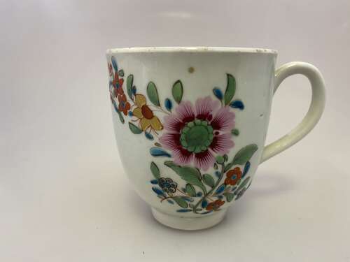 An early Worcester coffee cup painted with flowers, circa 1773.