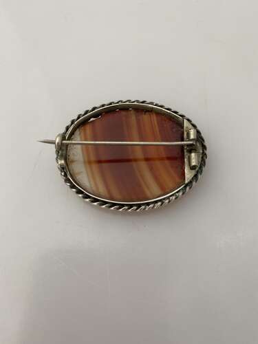 A Scottish silver and agate brooch, circa 1900.