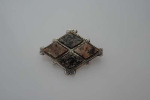 A Scottish silver and marble brooch.Circa 1900.