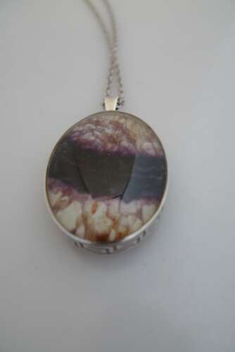 A silver and Blue John double sided pendant and chain.