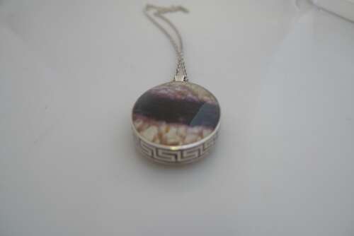 A silver and Blue John double sided pendant and chain.