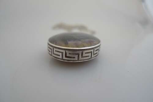 A silver and Blue John double sided pendant and chain.