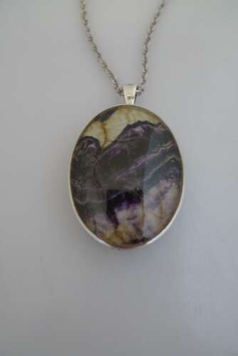 A silver and Blue John double sided pendant and chain.