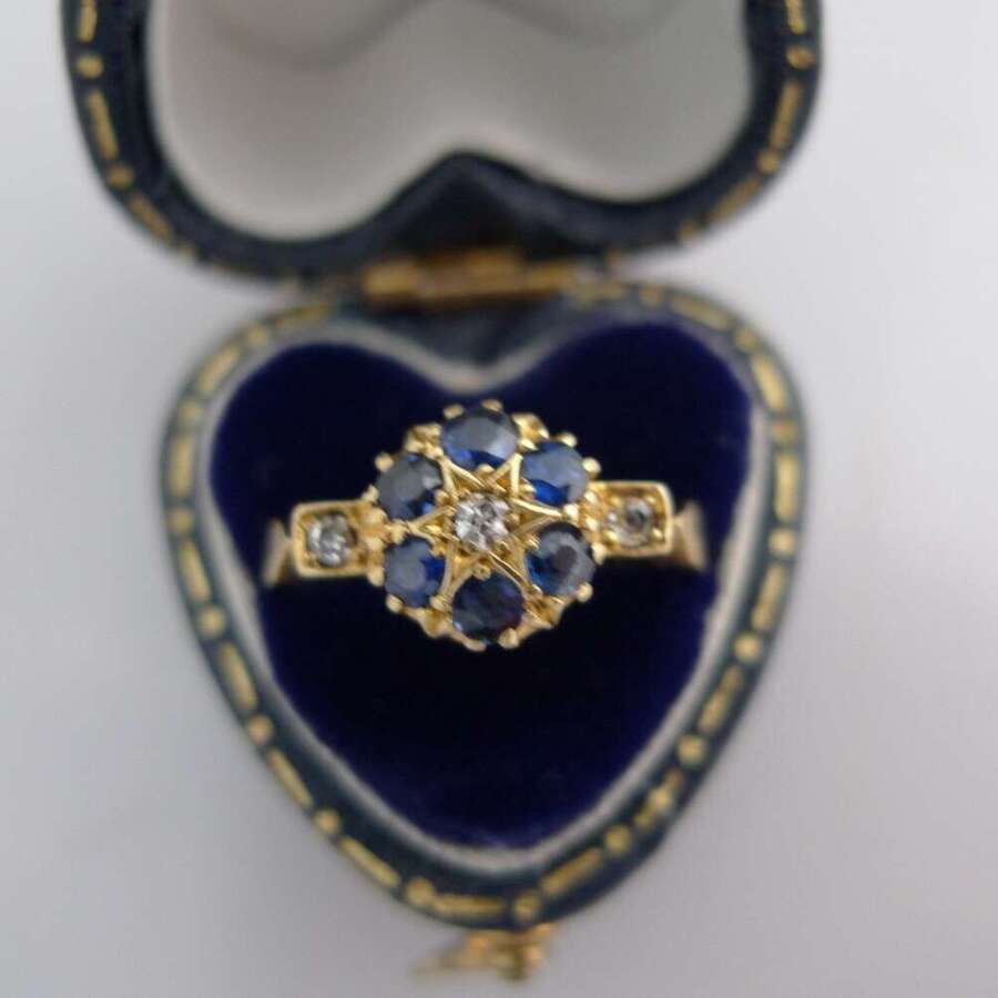 An 18ct Gold, Diamond and Sapphire ring.