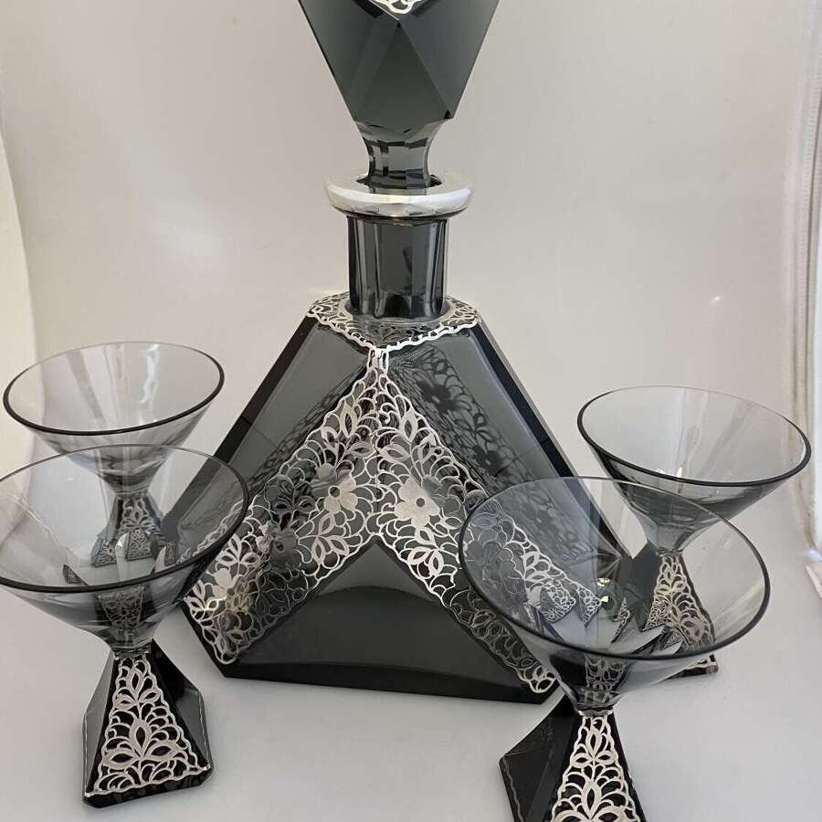 Karl Palda decanter and four glasses with applied silver. *chip to bottom of stopper.