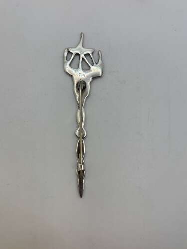Silver kilt pin with ship and celtic design.