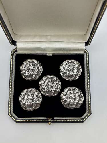 Cased set of five silver buttons.