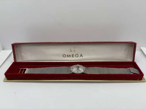 Omega ladies 18ct gold and diamond watch.